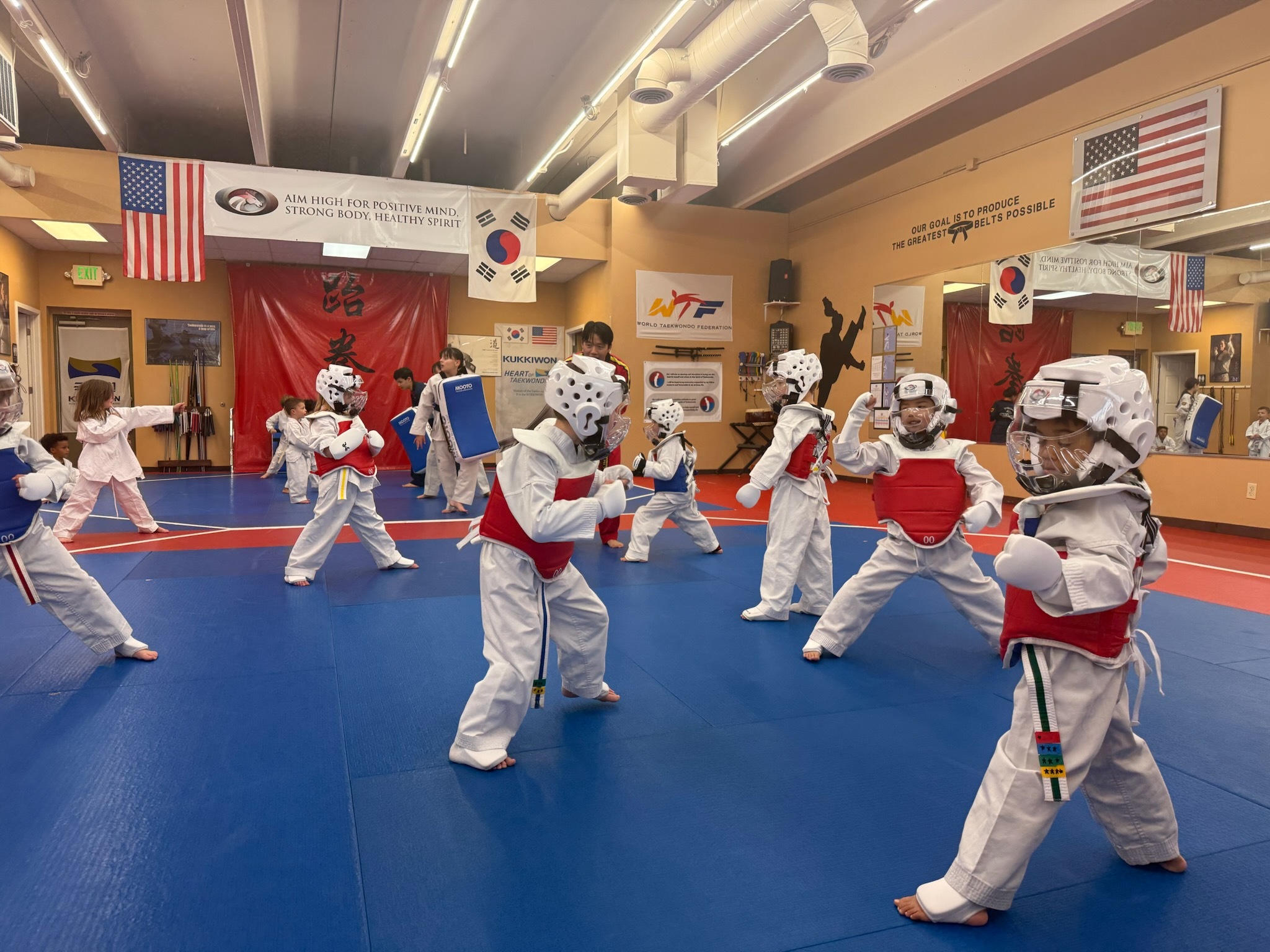 Little Champions sparring practice with protective gear